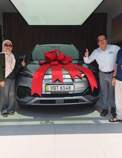Terrence Foo delivering BYD Dolphin to happy customer in BYD Cheras Millennium Motors, Kuala Lumpur.